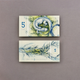Illustration for article titled Gorgeous Banknotes Feature Flora, Fauna—And Skeletons Under UV Light